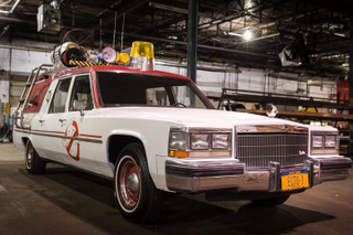 Illustration for article titled First picture of the new Ghostbusters in front of the ECTO-1 is badass